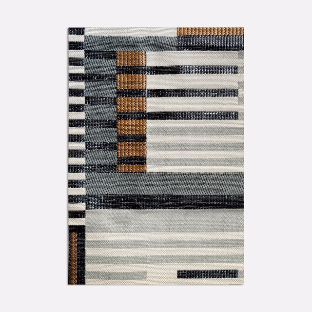 Muted lagoon jacquard with horizontal stripes, charcoal bars and copper-brown woven blocks