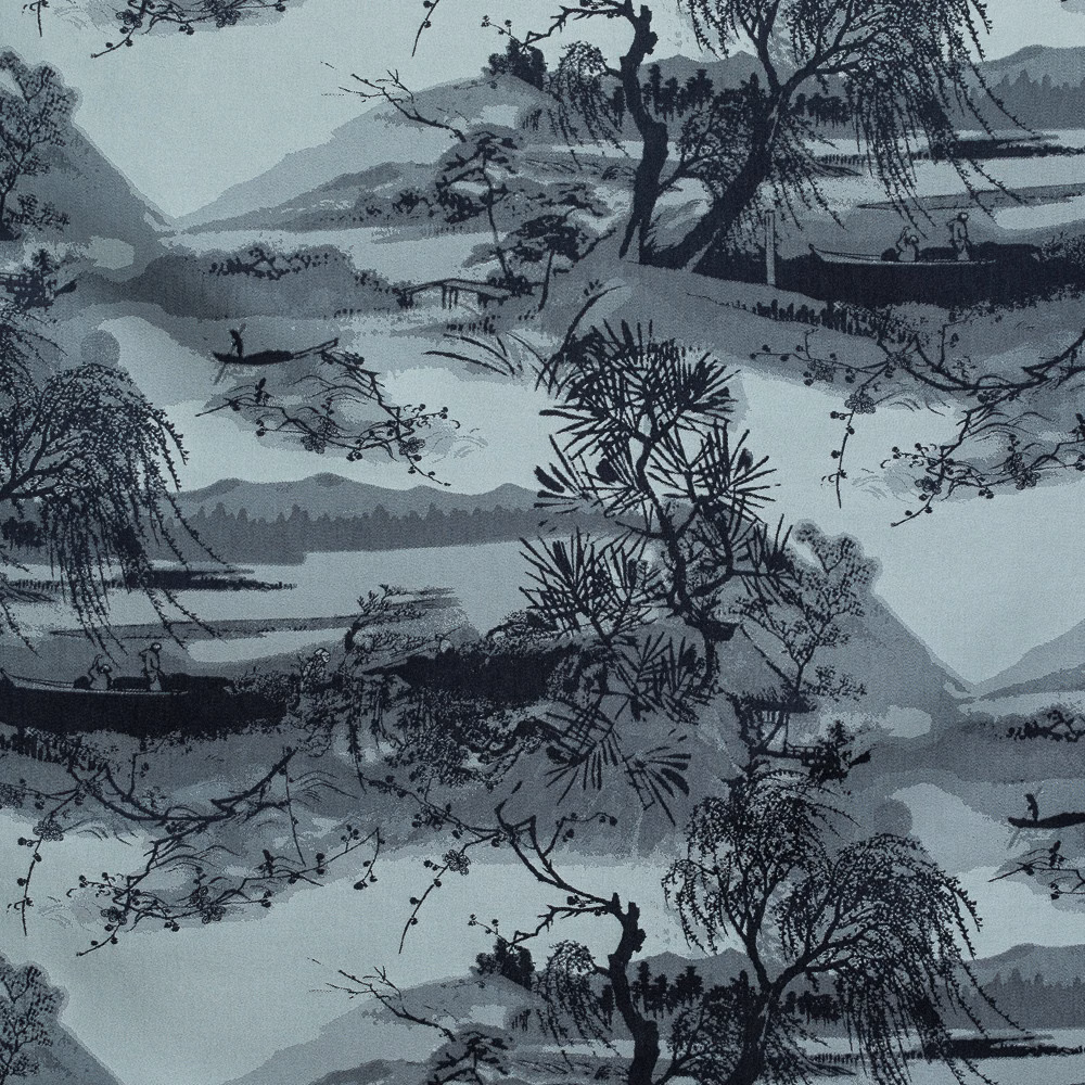 Blue-grey jacquard with dark pine trees, layered mountains and quiet water