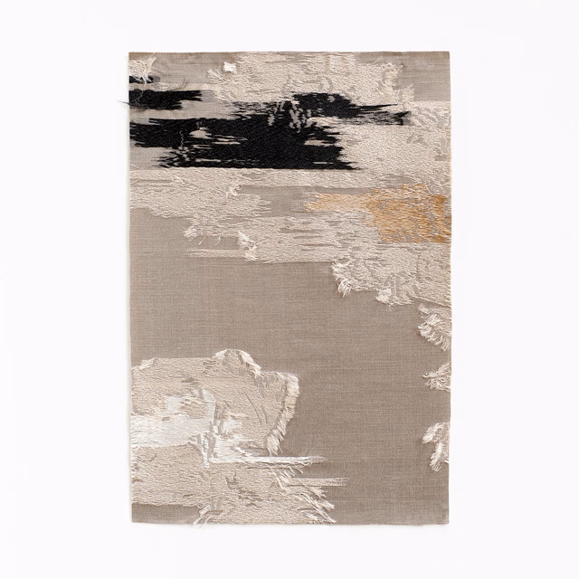 Taupe jacquard swatch with ivory floral brushstrokes, black accents and muted gold