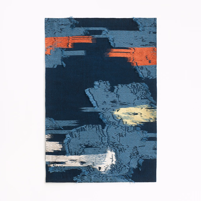 Ink navy jacquard with coral bands and pale abstract floral motifs