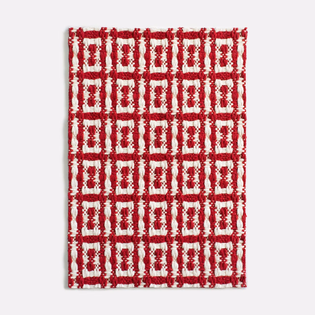 Cherry-red and cream raised geometric grid with chunky jacquard texture
