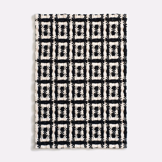 Black and ivory chunky jacquard with a tactile rectangular grid pattern