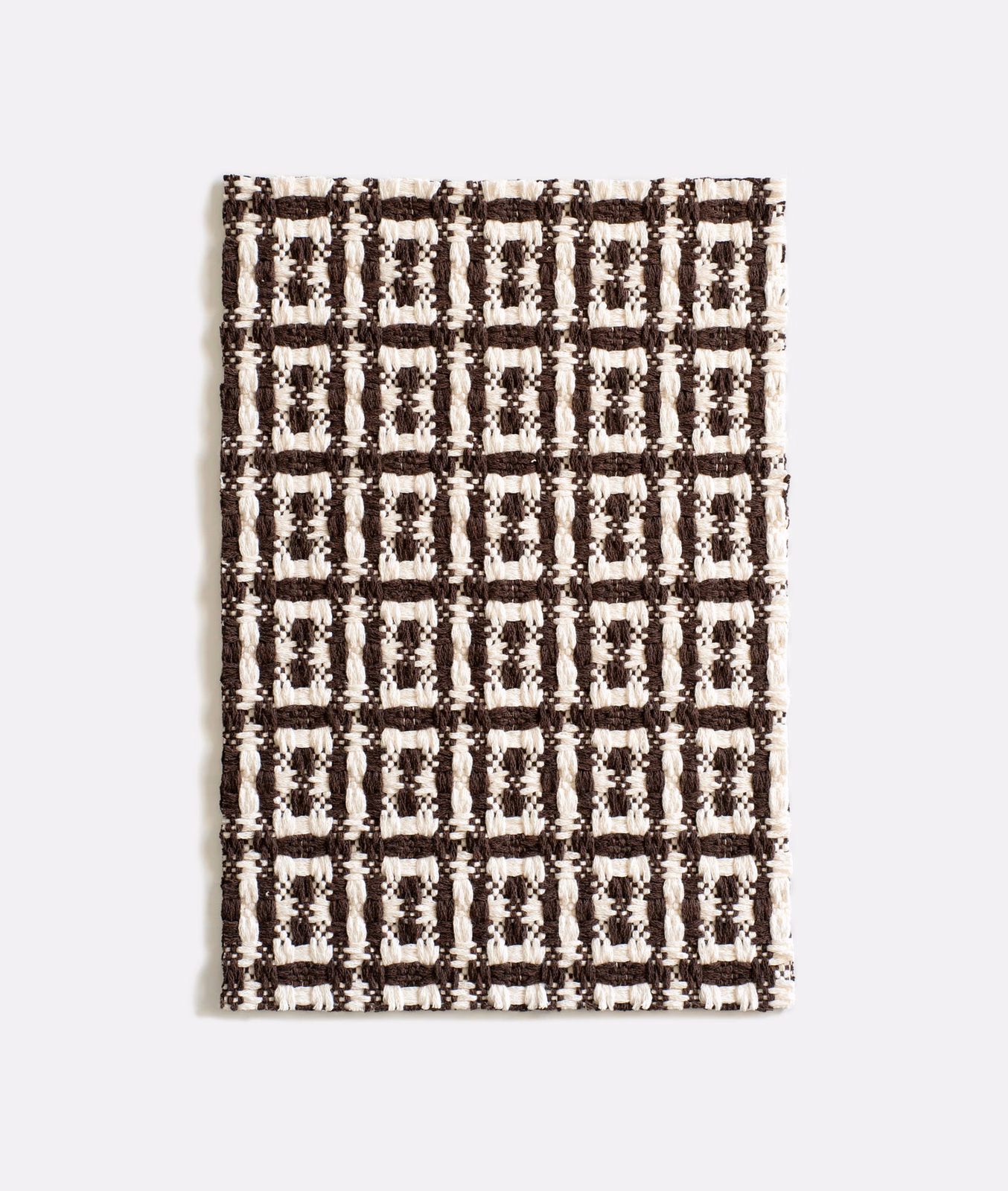 Chunky espresso-brown and ivory jacquard with repeating rectangular grid motifs