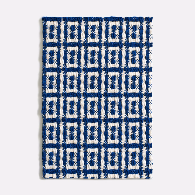 Deep navy jacquard with chunky cream geometric grid and raised textured weave