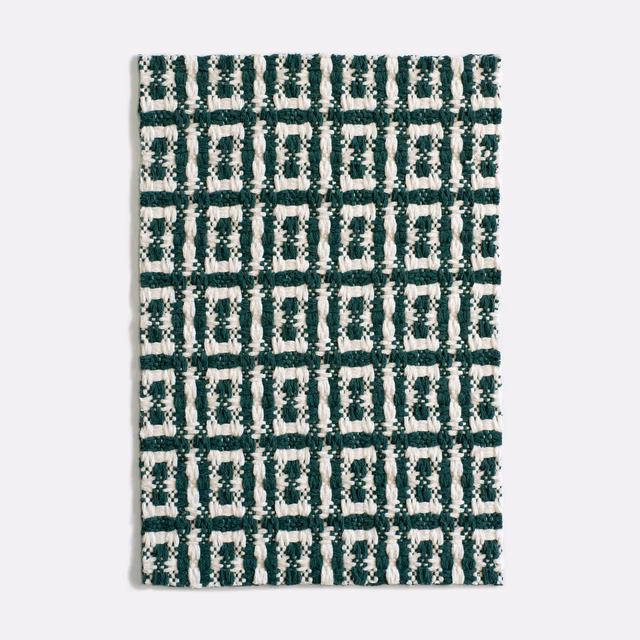 Forest green and ivory geometric jacquard with a raised, irregular checked weave