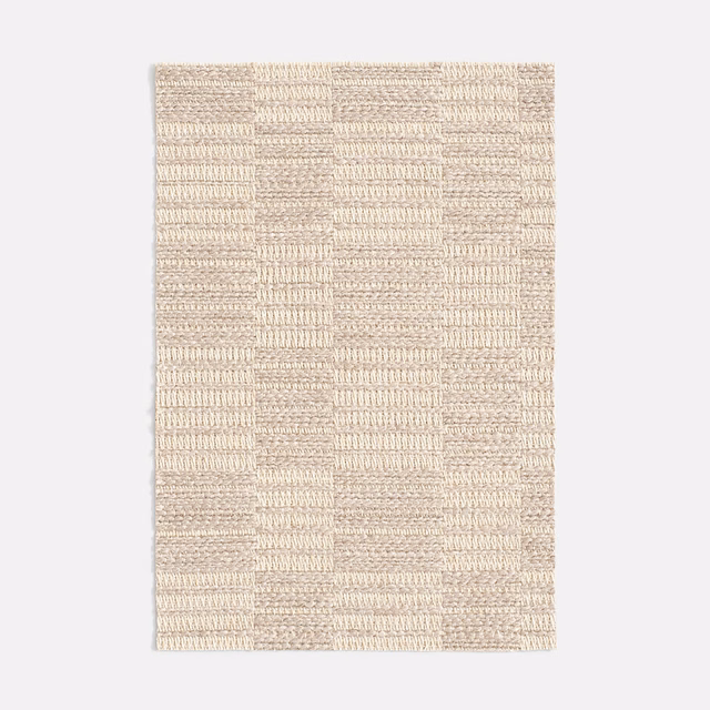 Warm ivory-beige jacquard with tactile rectangular blocks and subtle woven relief