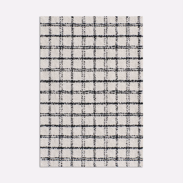 Pale grey jacquard with an irregular charcoal windowpane grid and tactile weave