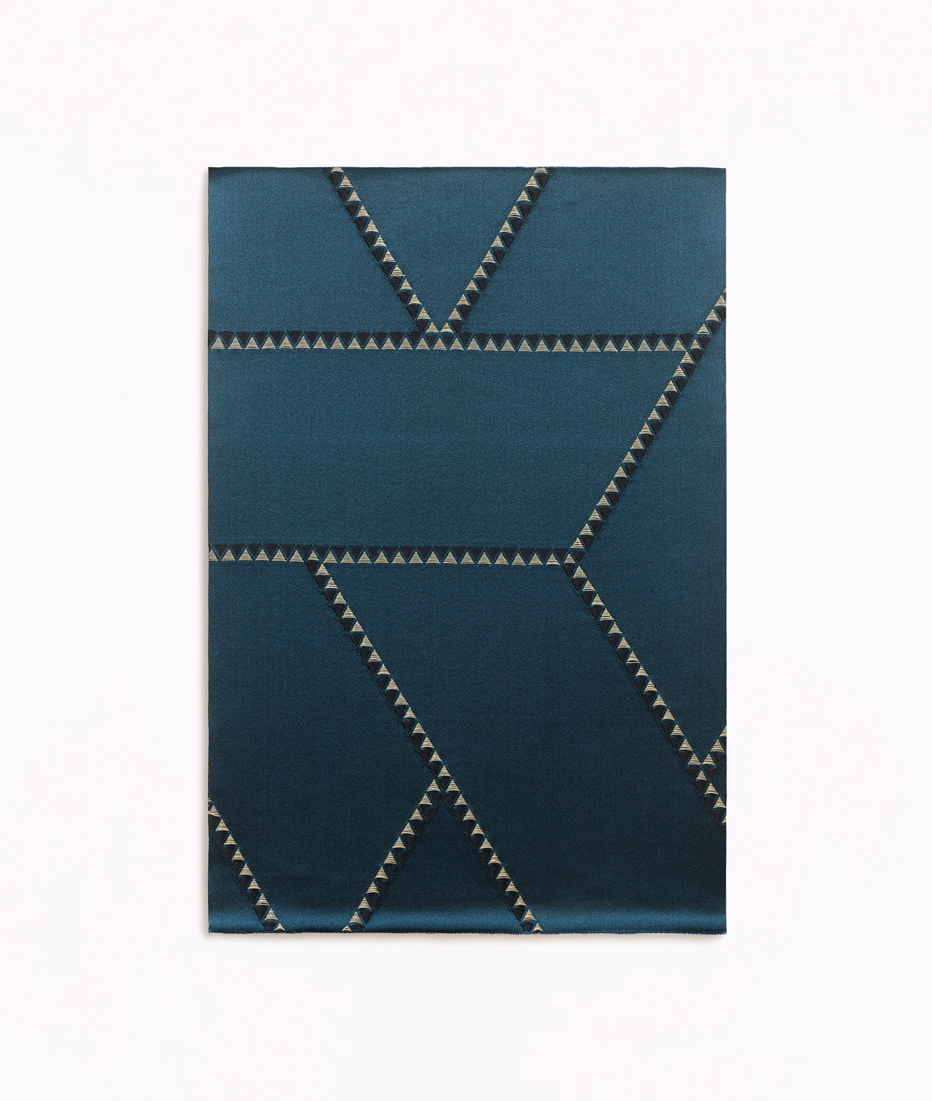 Deep blue jacquard with angular triangular-edged bands in a close-up swatch