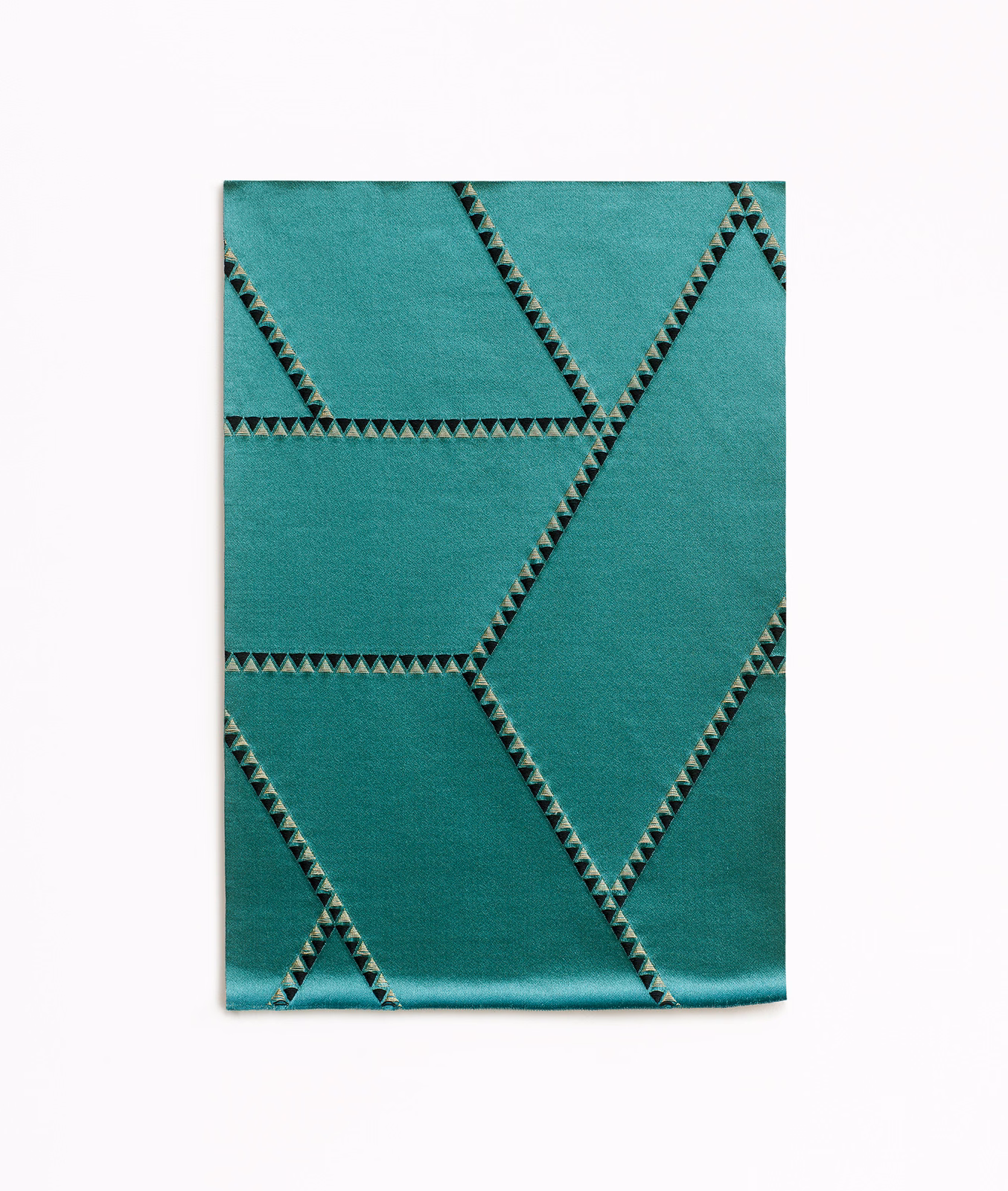 Deep malachite-teal jacquard with angular dark triangular lines and subtle sheen