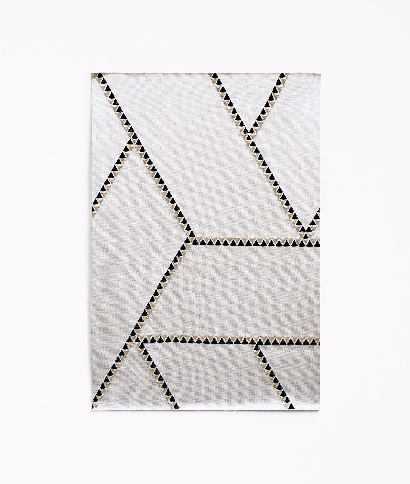 Soft white Jacquard with black triangular lines forming large angular geometric shapes