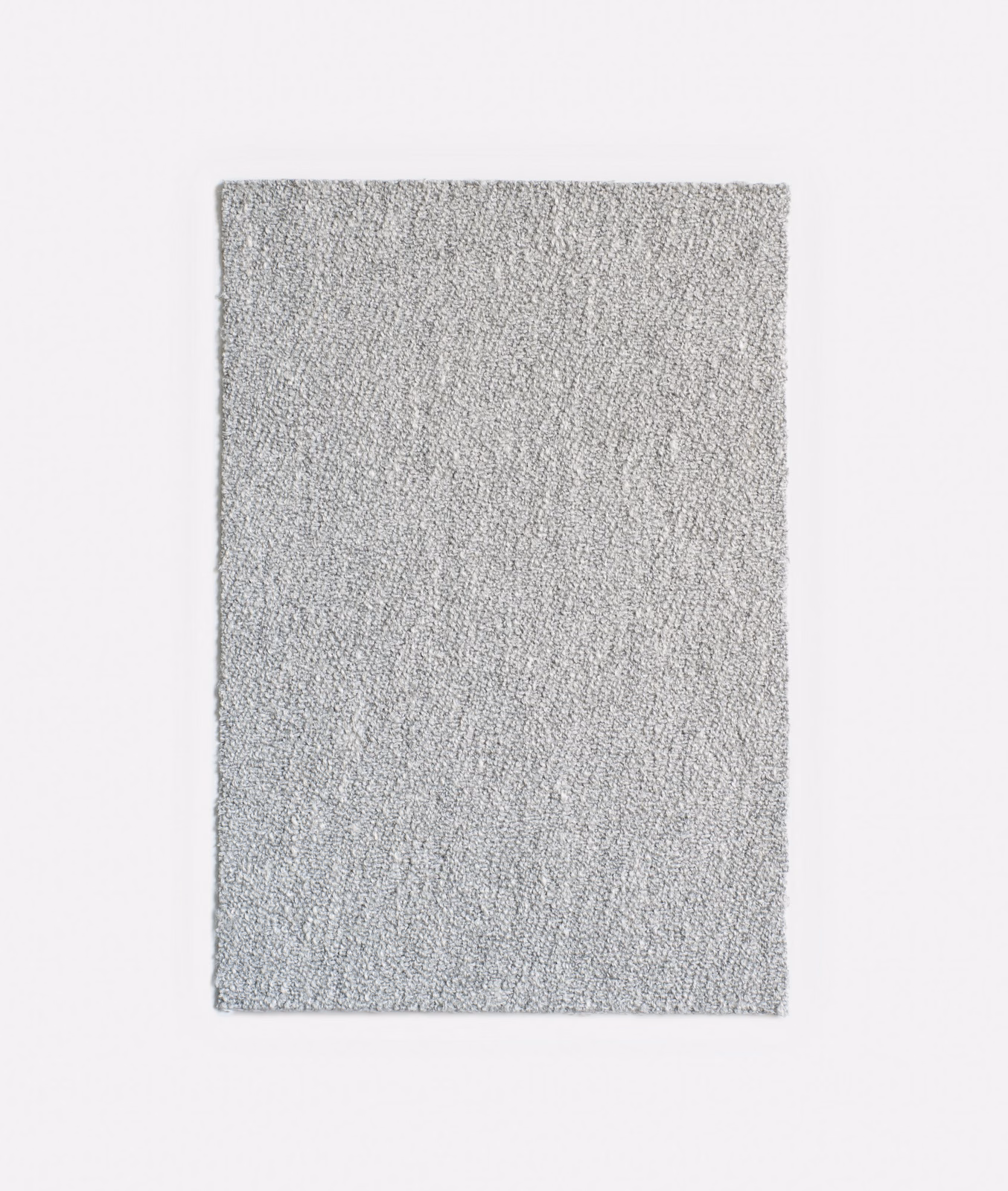 Pale cool-grey jacquard swatch with a dense, subtly vertical tactile weave