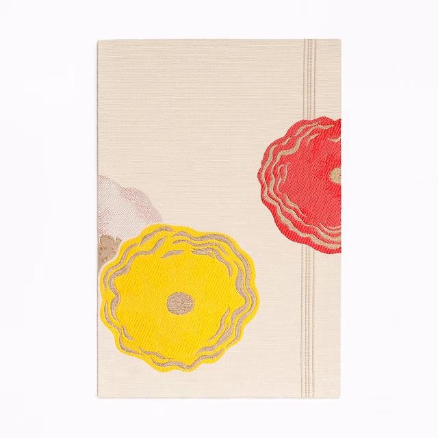 Cream jacquard with oversized yellow and red outlined flower motifs