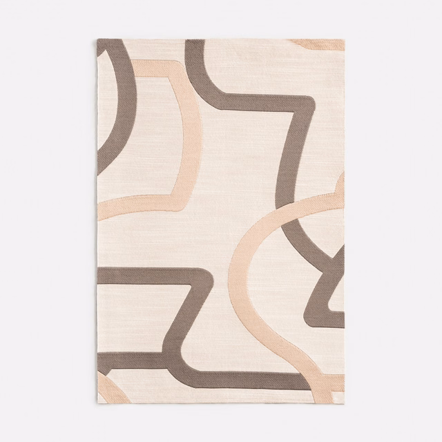 Ivory jacquard with taupe curved bands and pale peach interlocking arcs