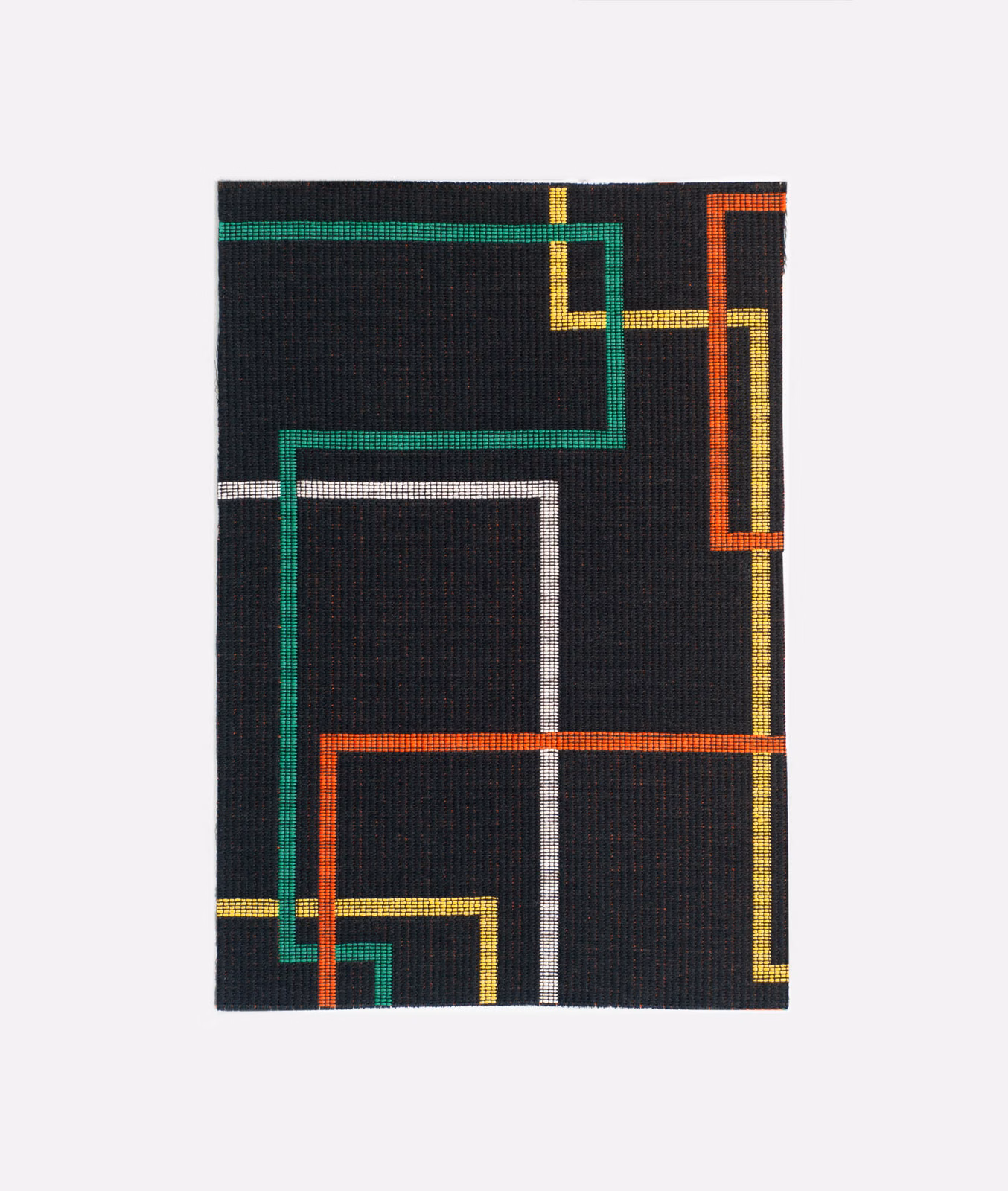 Black woven swatch with vivid green, orange, yellow and white geometric lines