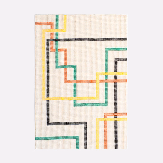 Ivory jacquard with charcoal, teal, coral and yellow interlocking lines