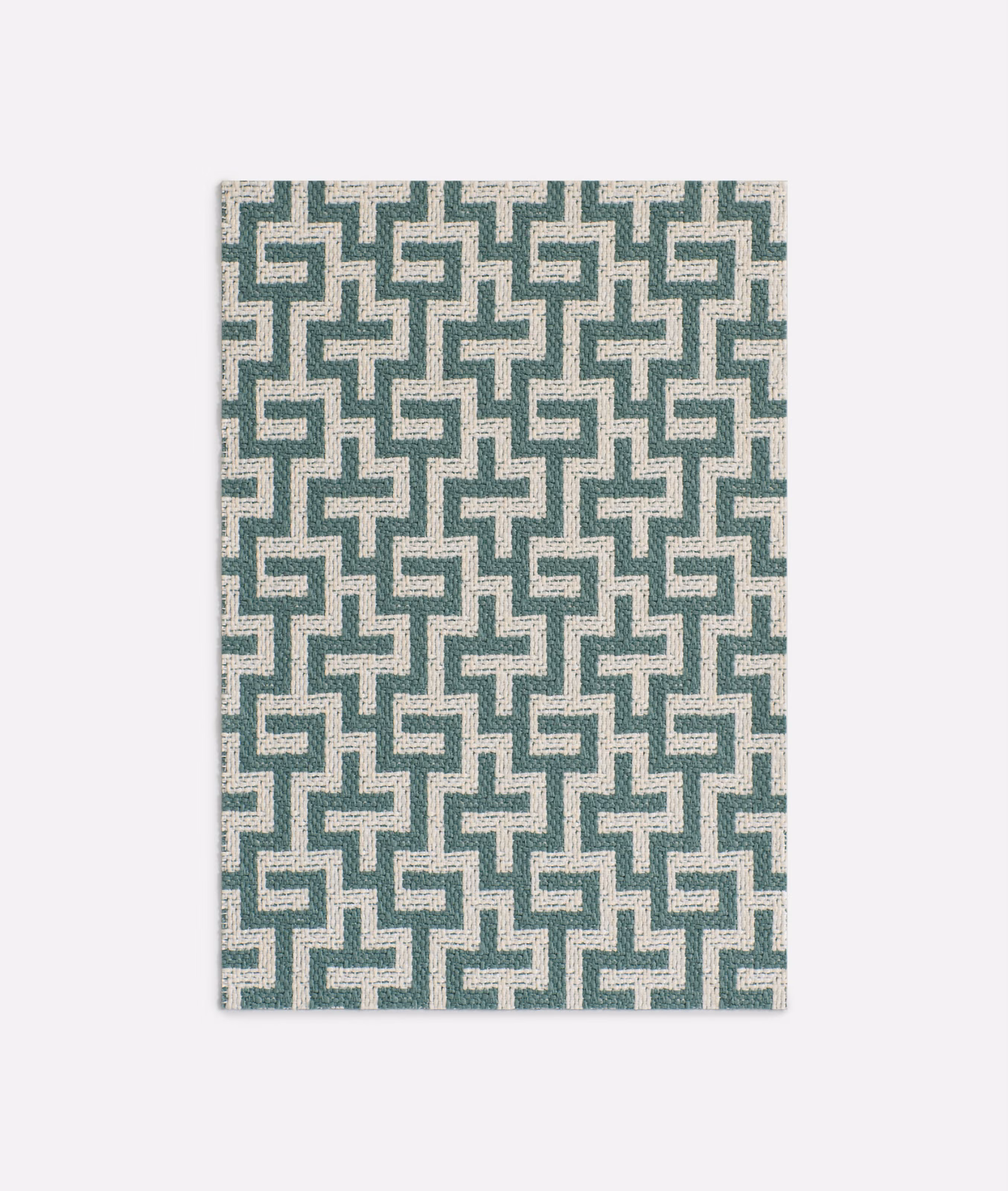 Muted lagoon-teal maze motif woven over a pale ivory ground