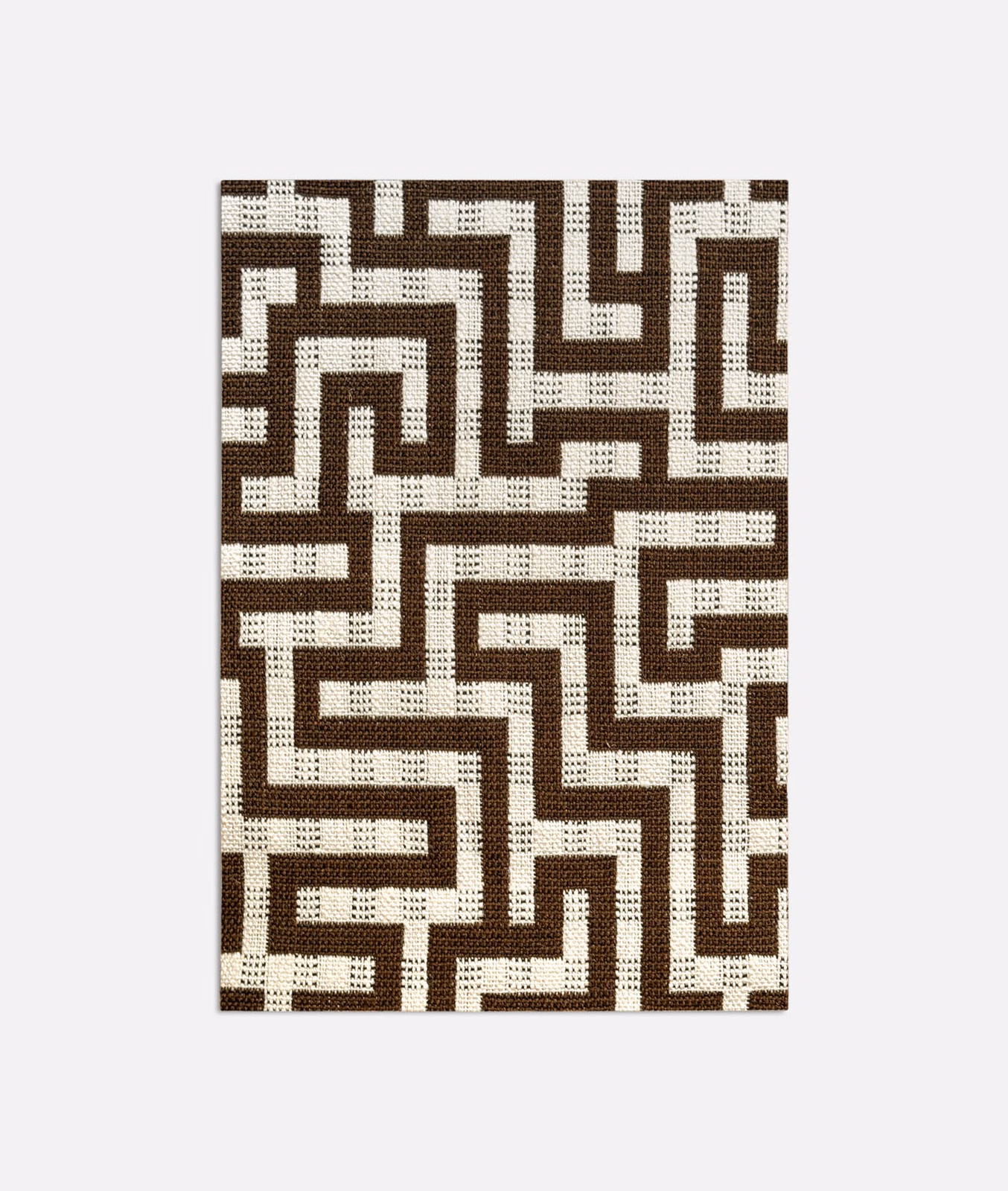 Brown and cream jacquard swatch with interlocking maze lines and flecked woven texture