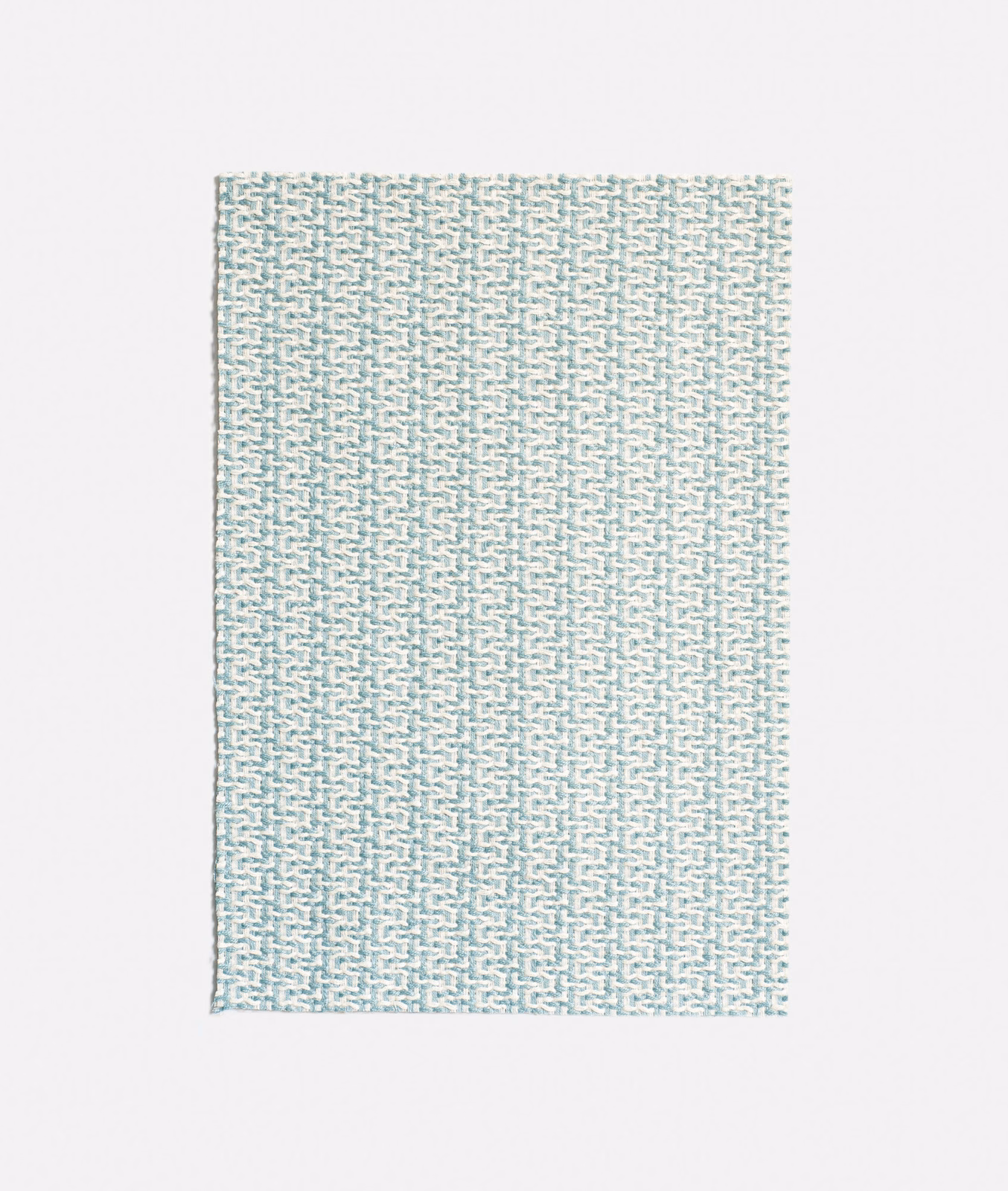 Pale aqua jacquard with tiny stepped geometric marks and a tactile woven surface