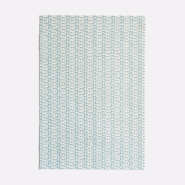 Pale aqua jacquard with tiny stepped geometric marks and a tactile woven surface