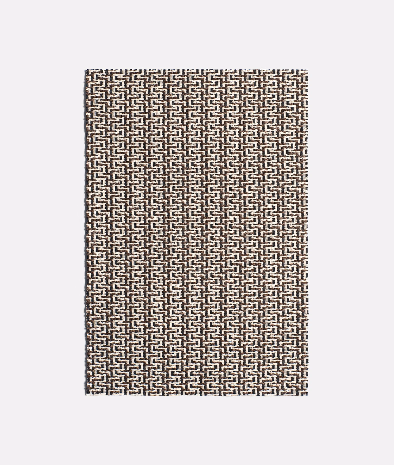 Ebony brown and ivory jacquard with a tightly repeated interlocking geometric motif