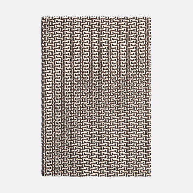 Ebony brown and ivory jacquard with a tightly repeated interlocking geometric motif