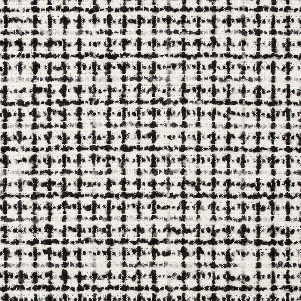 Close-up of black and ivory jacquard with an irregular nubby grid weave