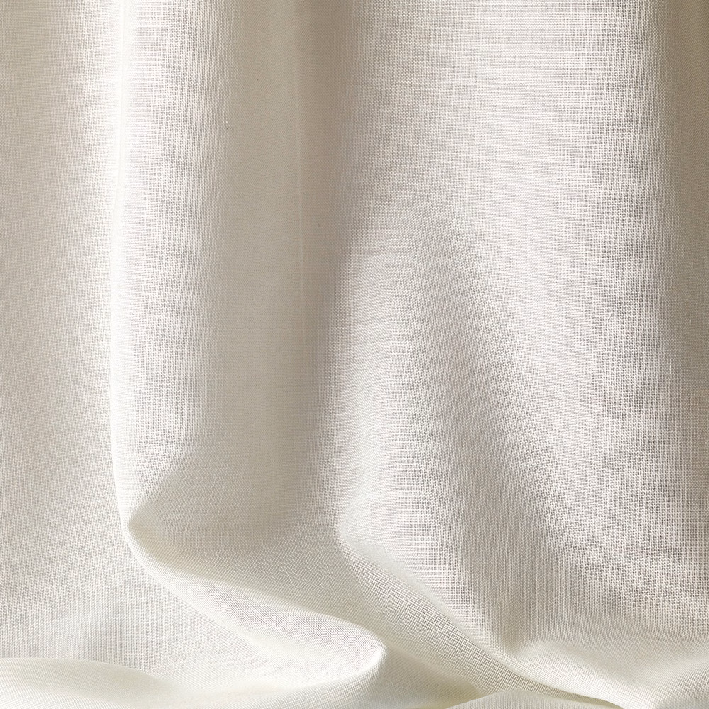 Pale ivory woven fabric falling in soft, translucent vertical folds