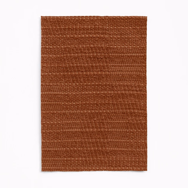 Warm chestnut-brown jacquard swatch with irregular horizontal woven texture