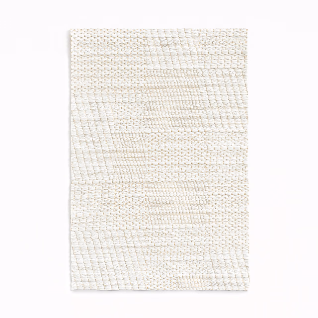 Warm ivory jacquard with irregular horizontal patchwork blocks and tactile woven surface