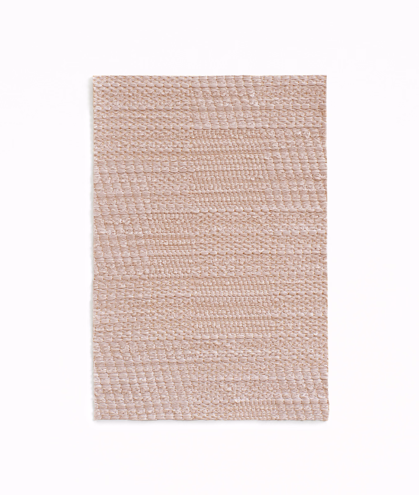 Pale blush rose jacquard swatch with irregular horizontal patchwork weave