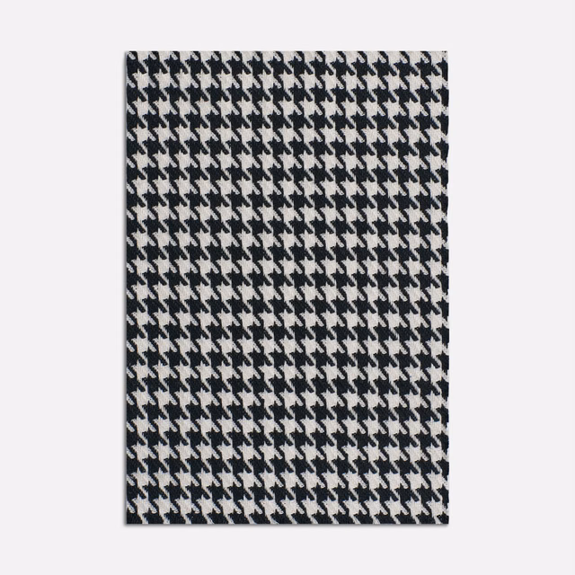 Black and ivory small-scale houndstooth jacquard with a dense textured weave