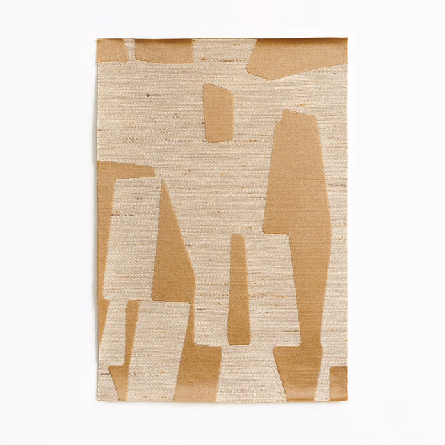 Warm oat-beige jacquard with camel geometric blocks and horizontal woven texture