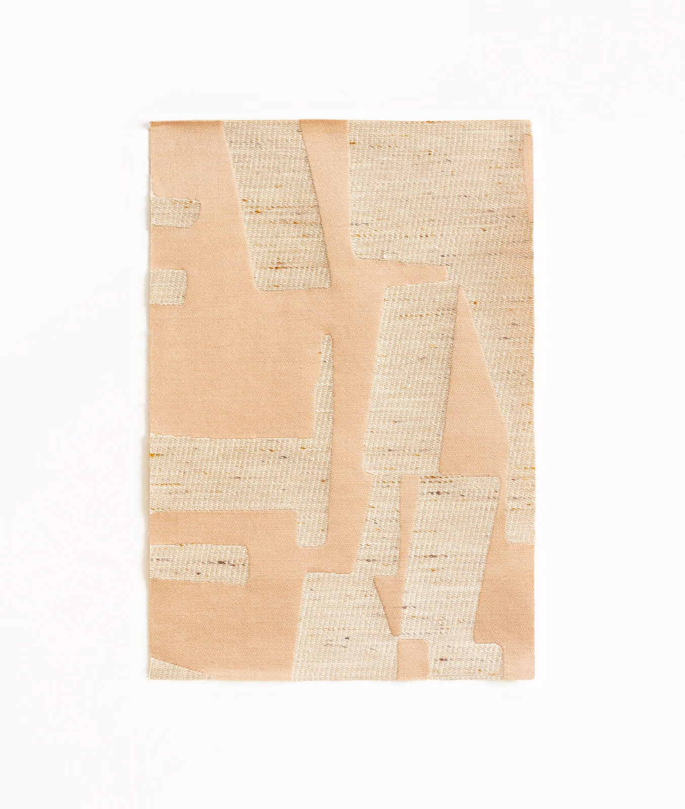Peach-pink jacquard with raised cream geometric woven panels and tactile texture