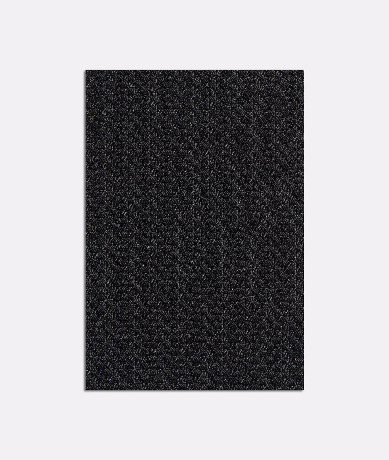 Near-black jacquard swatch with a fine repeating geometric weave