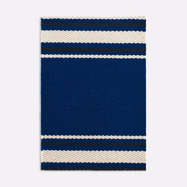 Deep navy woven fabric with cream horizontal bands and fine diagonal texture