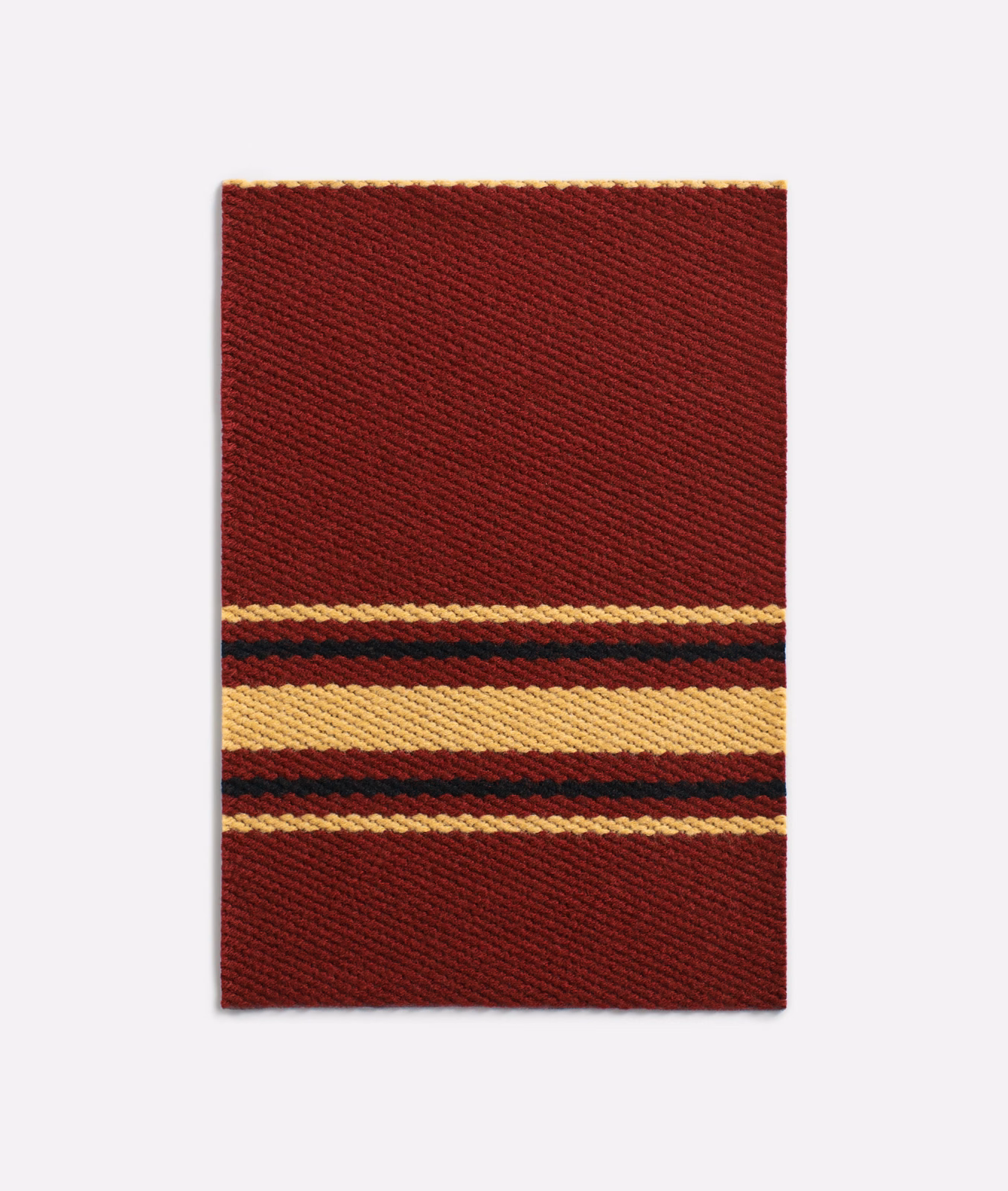 Deep bordeaux jacquard swatch with mustard, cream and dark horizontal bands