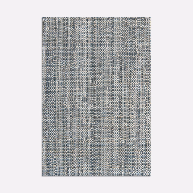 Cool denim-blue jacquard with grey flecks and a dense textured weave