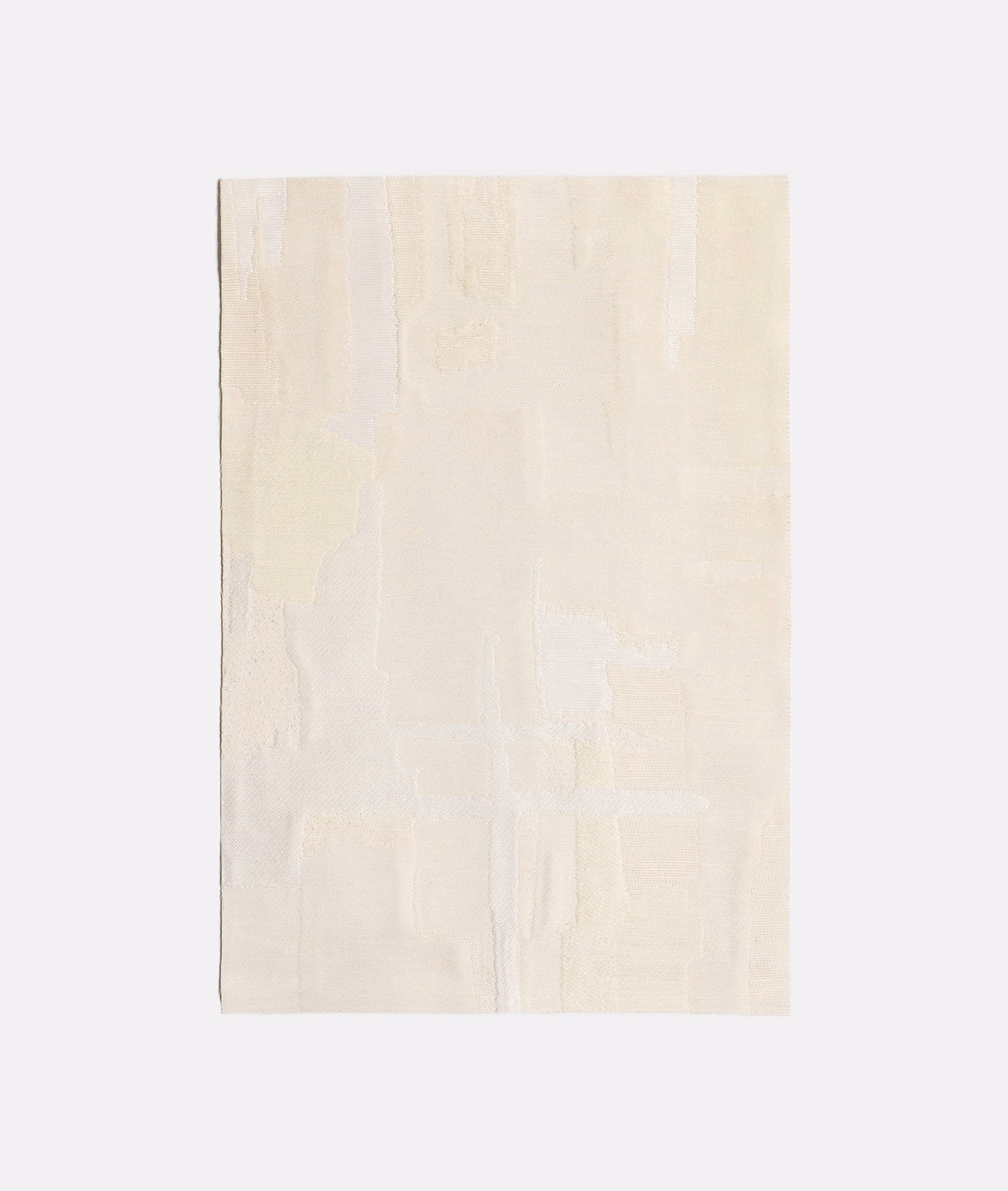 Soft ivory jacquard swatch with faint vertical panels and tonal woven relief