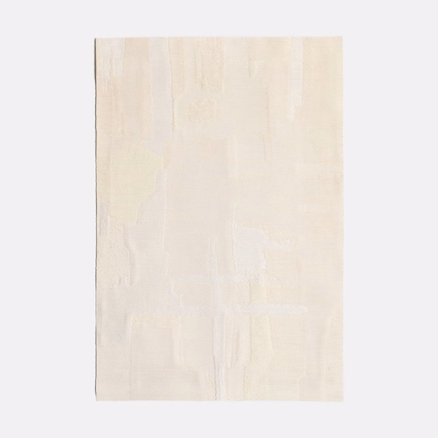 Soft ivory jacquard swatch with faint vertical panels and tonal woven relief