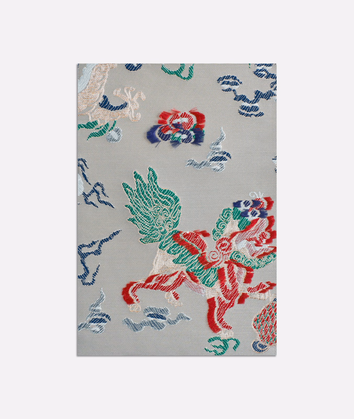 Pale blue-grey jacquard with red, green and navy ornamental figures