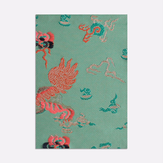 Mint-teal jacquard with coral dragon-like motifs and pink ornamental curls