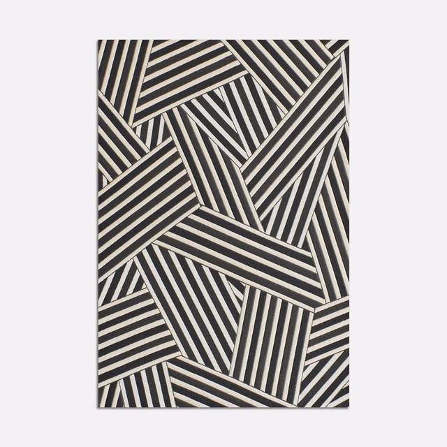 Black and ivory jacquard with interlocking angled stripe panels and woven texture
