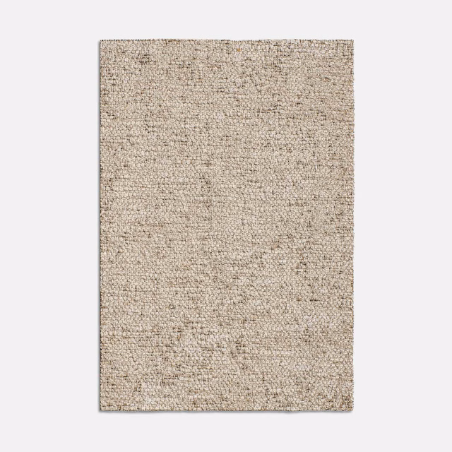 Warm cipria beige jacquard swatch with dense mottled woven texture