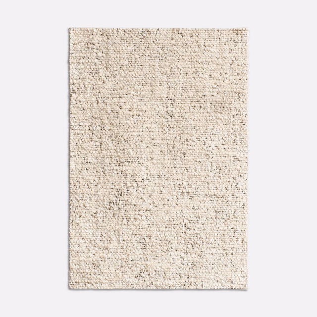 Pale oyster-cream jacquard swatch with dense irregular flecked texture