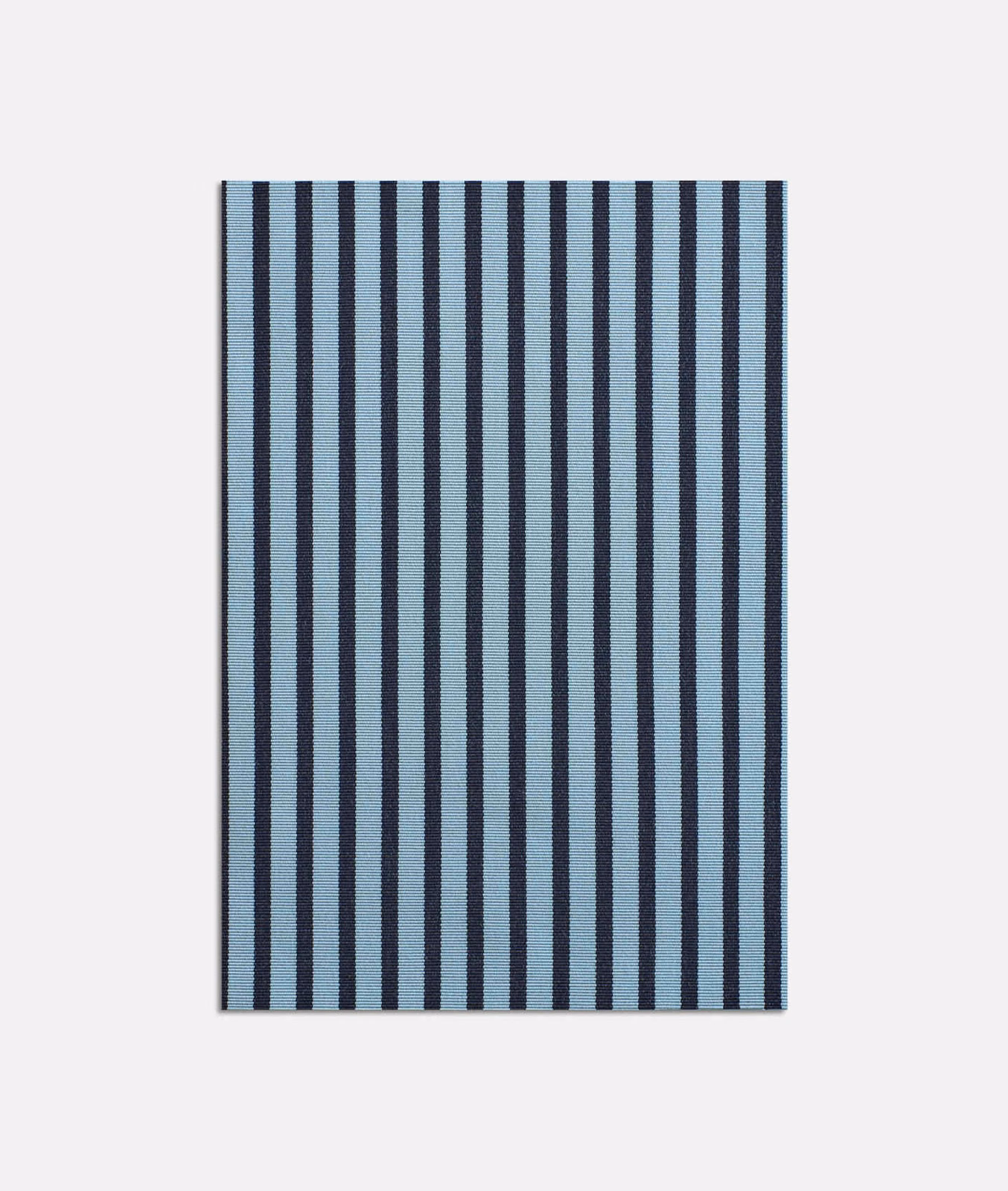 Muted blue and ink navy vertical stripes in a finely textured jacquard weave