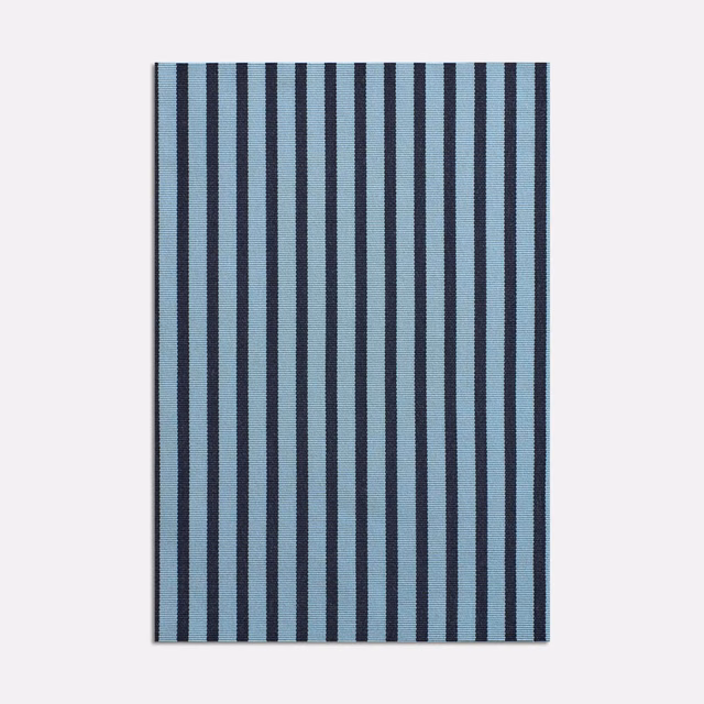 Muted blue and ink navy vertical stripes in a finely textured jacquard weave