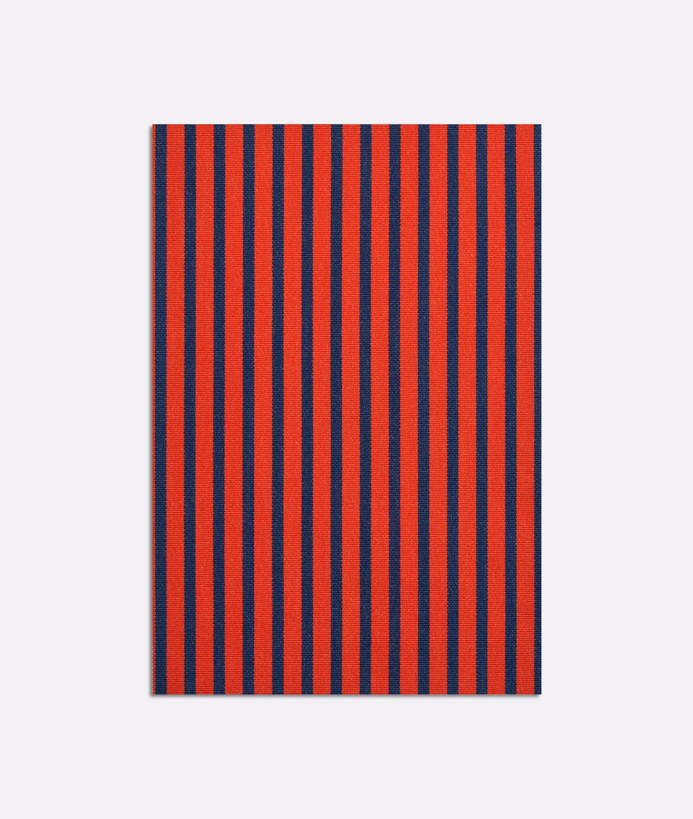 Close view of narrow rouge and navy vertical stripes in a textured jacquard weave
