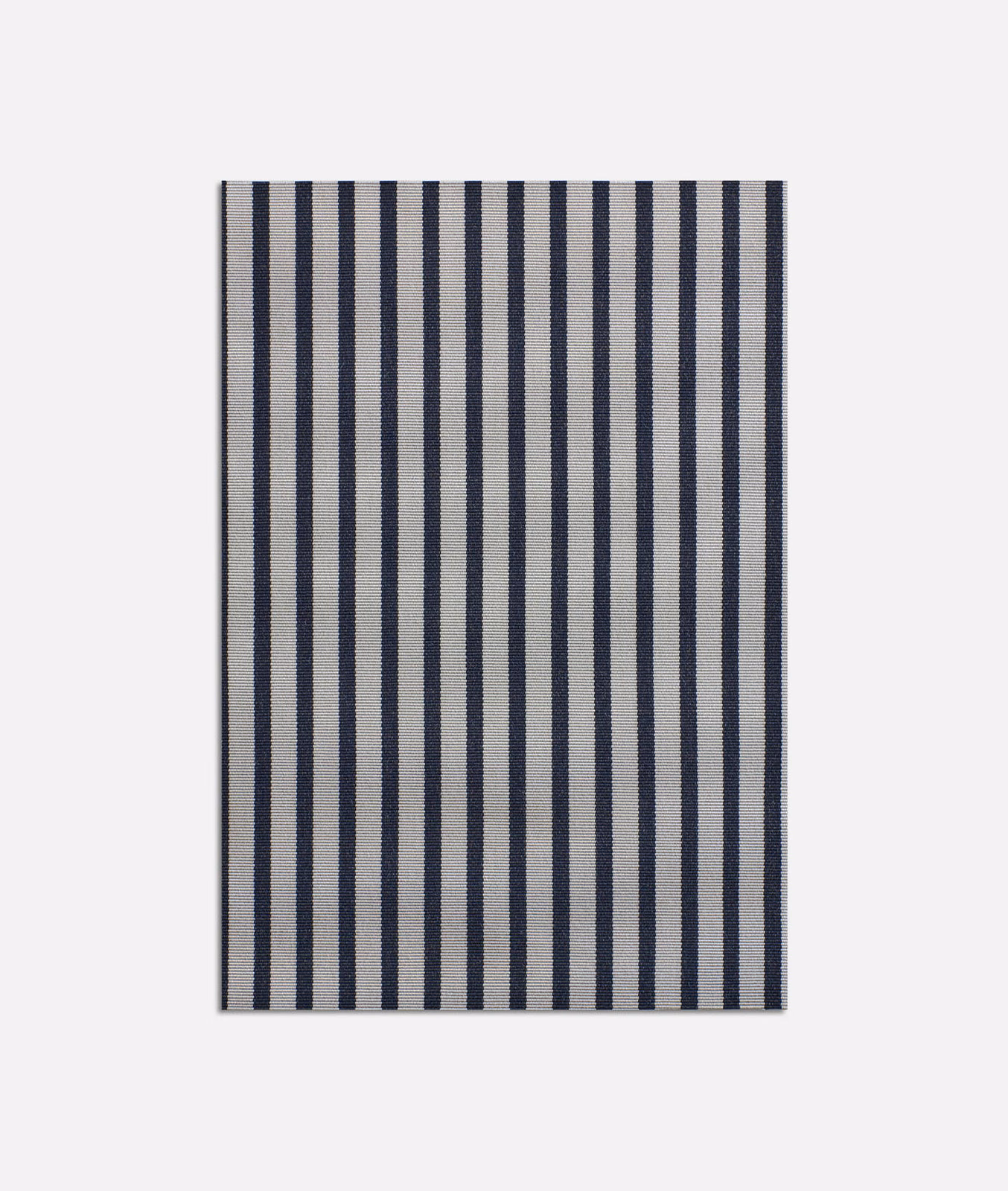 Ink navy and ivory vertical stripes on a lightly grainy woven surface