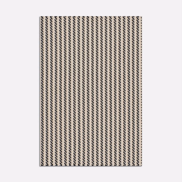 Cream jacquard swatch with tightly spaced black diagonal chevron stripes
