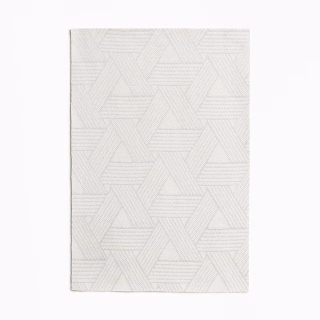 Pale pearl jacquard swatch with layered triangular outlines and fine horizontal woven ridges